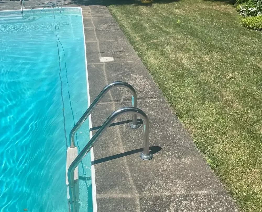 Before — Concrete pressure washing before and after in Hamilton